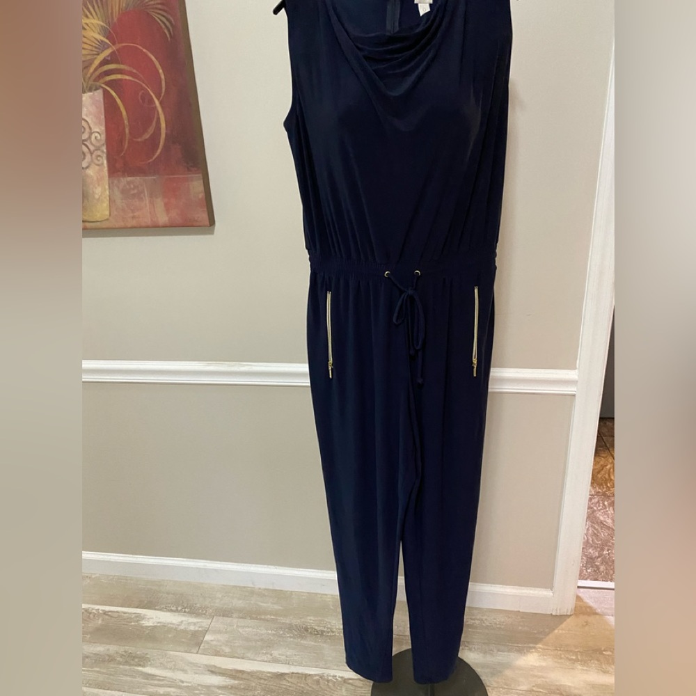 Chico’s Jumpsuit One Piece Navy Blue has zippered pockets